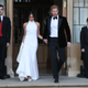 Meghan Duchess of Sussex, and Prince Harry Duke of Sussex, leave Windsor Castle after their wedding to attend an evening reception at Frogmore House on May 19, 2018 in Windsor, England.